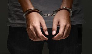 man in handcuffs | When Misdemeanor Domestic Violence Becomes a Felony