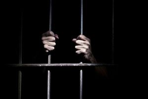 Hands of the prisoner | Steps to Take if Falsely Accused of a Crime